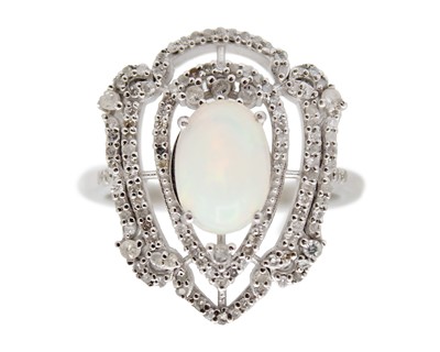 Lot 71 - A silver, opal, and diamond dress ring.