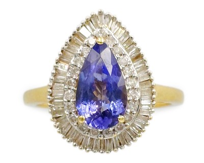 Lot 101 - A 14k gold, tanzanite, and diamond cluster ring.