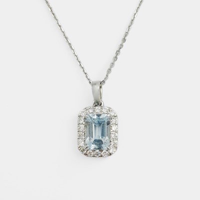 Lot 167 - An attractive 9k white gold, aquamarine, and diamond halo pendant on a 9k gold chain.