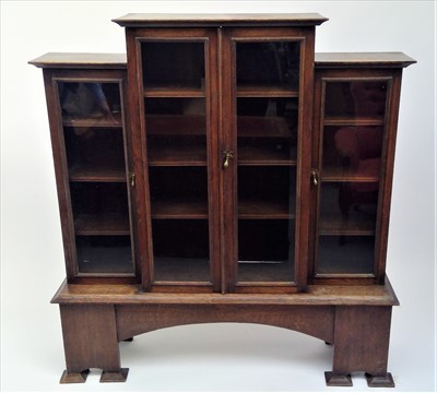 Lot 3518 - An Arts Crafts oak breakfront bookcase, with...
