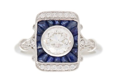 Lot 111 - An Art Deco-style 18k white gold, 1ct diamond, and sapphire ring.