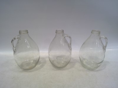 Lot 136 - Three Wine Jugs. The Jugs are 26cm tall.