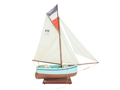 Lot 38 - A rigged model sailboat.
