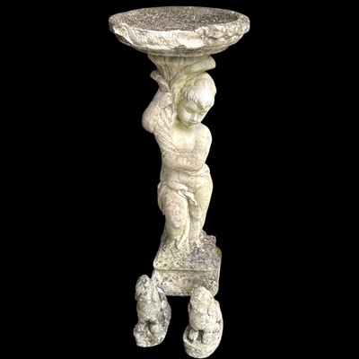 Lot 153 - A reconstituted stone birdbath 87cm tall and...