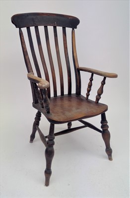 Lot 3534 - A beech and elm lathe back armchair, 19th...