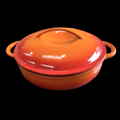 Lot 178 - A cast iron orange shallow casserole dish...