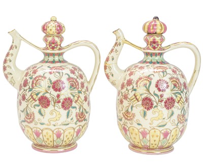 Lot 448 - A pair of late 19th century Zsolnay Pecs pottery wine ewers.
