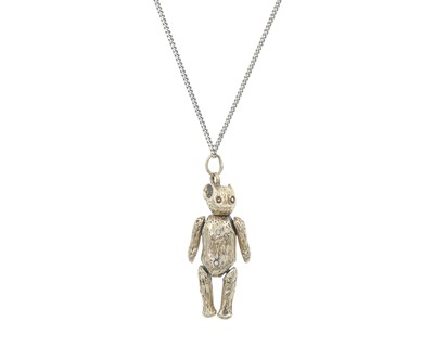 Lot 88 - A 9k gold articulated Teddy bear pendant on a silver chain.