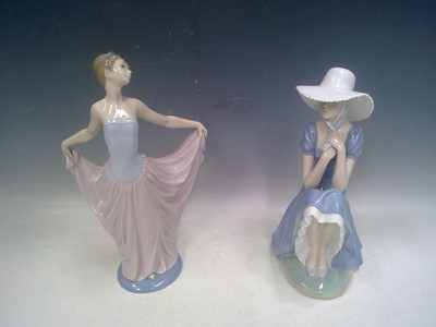 Lot 48 - A Lladro and Nao Figure. The Lladro is 32cm tall.
