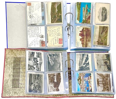 Lot 228 - Two folders containing a mixed lot of postcards old and modern.