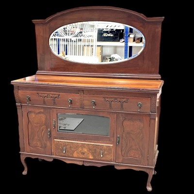 Lot 24 - An Edwardian mahogany and walnut mirror-backed...