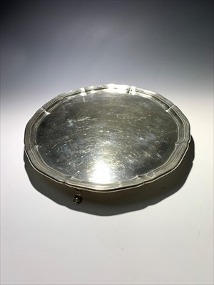 Lot 2016 - A pre-war silver shaped tray on three legs...