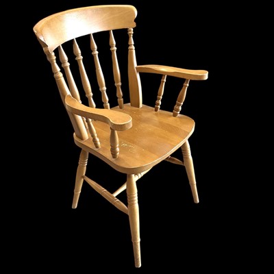 Lot 149 - A solid beech carver chair.