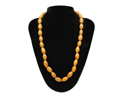 Lot 46 - An assortment of amber and amber-style bead necklaces.