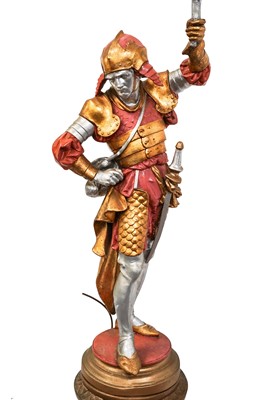 Lot 49 - A large plaster floor lamp, modelled as a figure of a warrior.