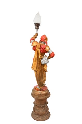 Lot 49 - A large plaster floor lamp, modelled as a figure of a warrior.