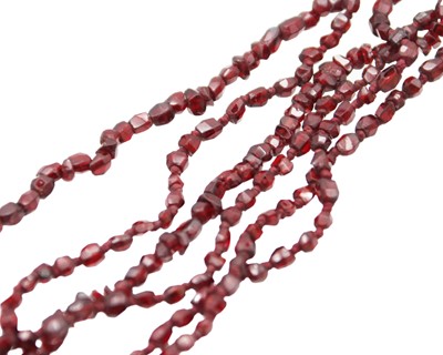 Lot 41 - A very fine garnet bead necklace, and two strings of garnets.