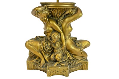 Lot 83 - A gilt and cream painted plaster table lamp.