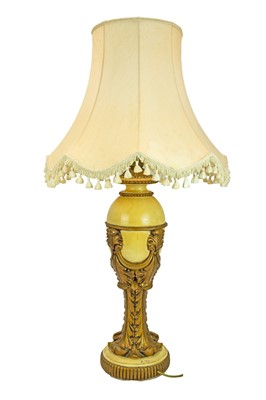 Lot 83 - A gilt and cream painted plaster table lamp.