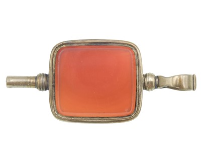 Lot 137 - A higher-purity gold and carnelian pocket watch winder.