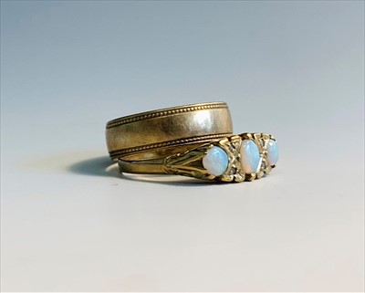 Lot 2651 - A 9ct gold Victorian style ring set with opals...