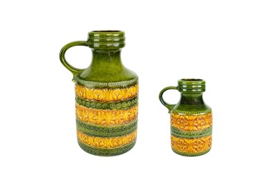 Lot 715 - A graduated pair of West German vases.