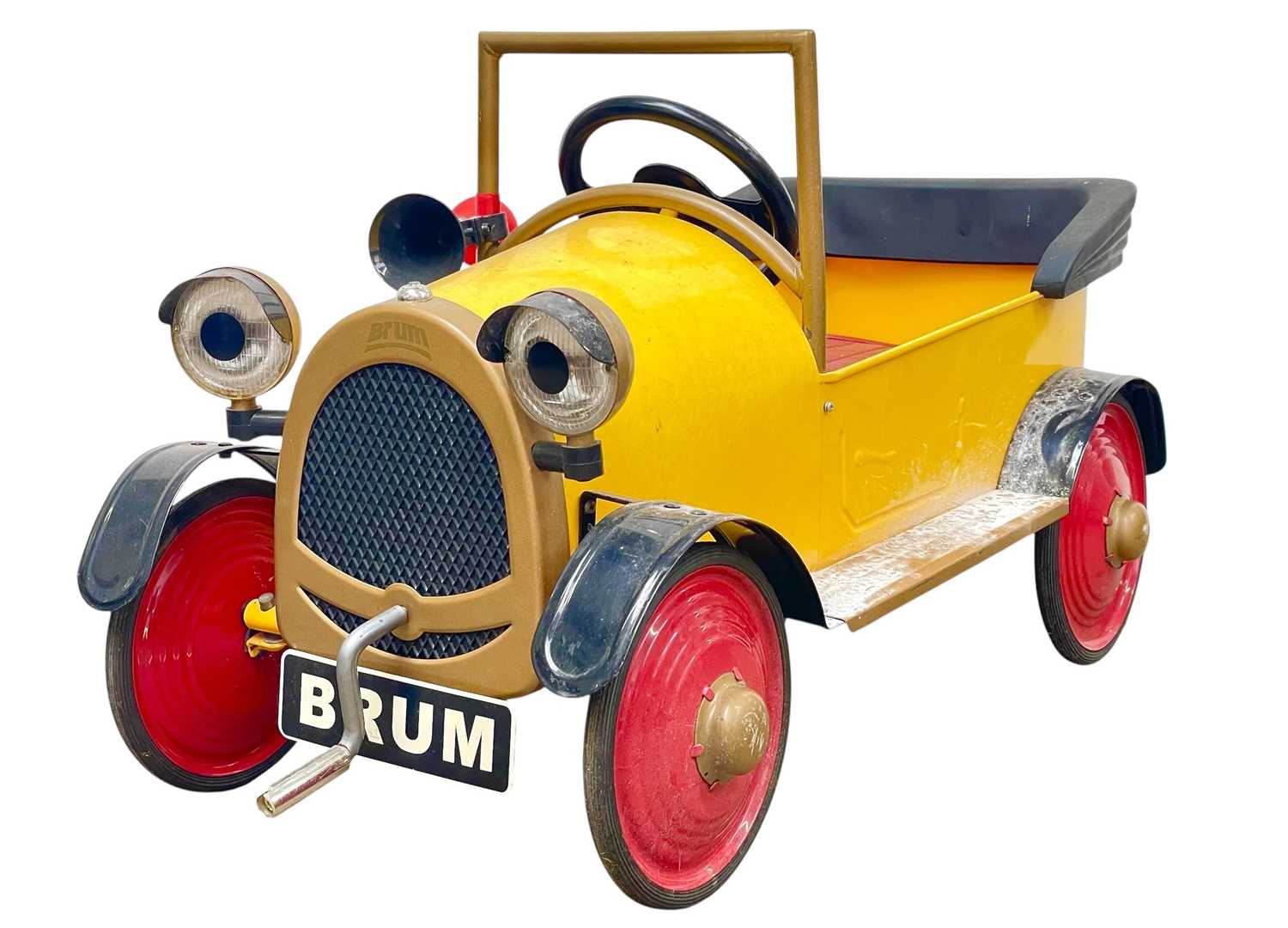 Lot 379 - A vintage official Brum toy peddle car.