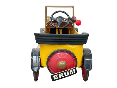 Lot 379 - A vintage official Brum toy peddle car.