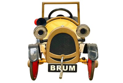 Lot 379 - A vintage official Brum toy peddle car.