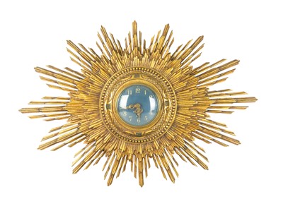 Lot 801 - A gilt wood sunburst wall clock.