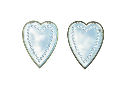 Lot 836 - A pair of heart-shaped sorcerer's mirrors.