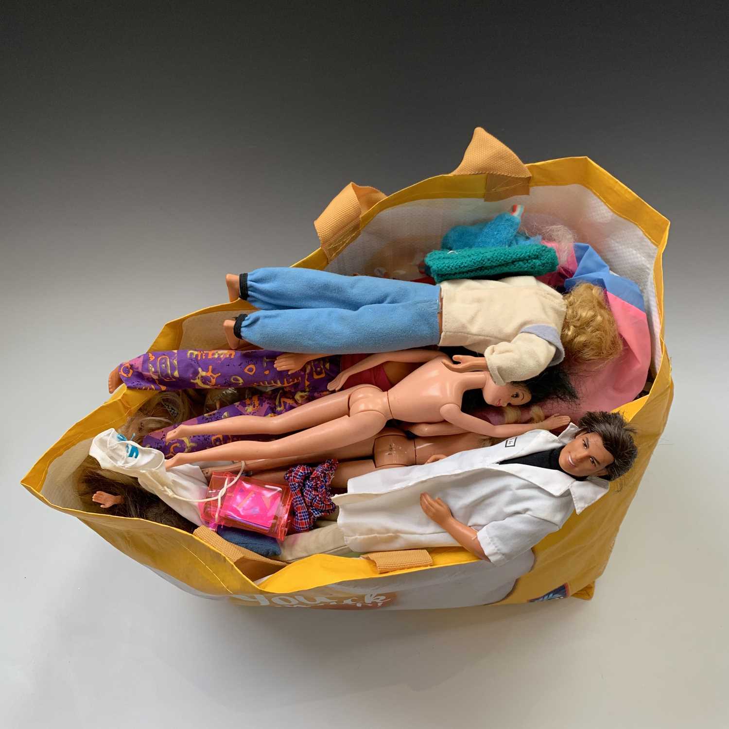 Lot 607 - DOLLS: A bag containing 17 Barbie & Ken dolls...