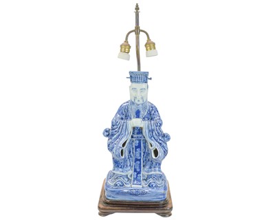 Lot 651 - A Chinese blue and white porcelain figural lamp.