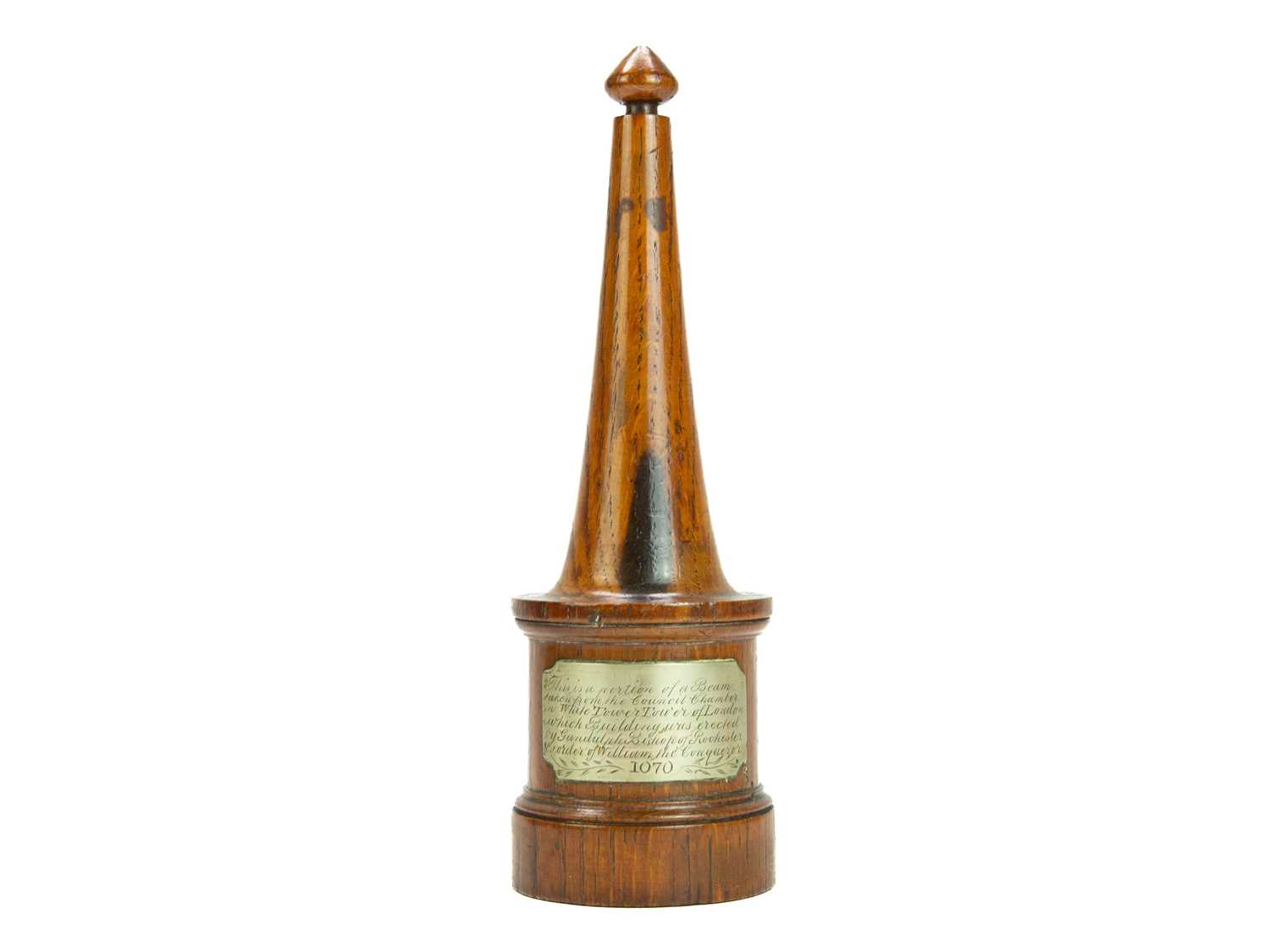 Lot 19 - A carved oak desk ornament.