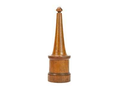 Lot 19 - A carved oak desk ornament.