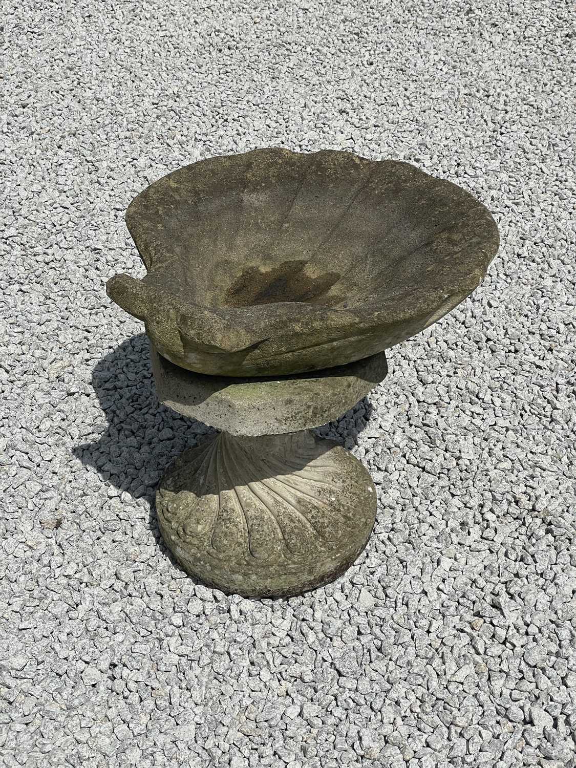 Lot 757 - A reconstituted stone clam shell.
