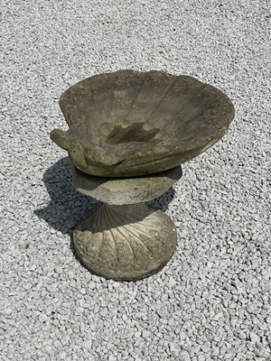 Lot 757 - A reconstituted stone clam shell.