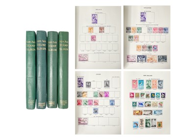 Lot 212 - Four Stanley Gibbons New Age Stamp Albums containing world stamps, mint and used.
