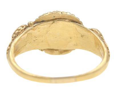 Lot 155 - An Antique Etruscan style granulated gold three-stone pink sapphire and tourmaline set ring.