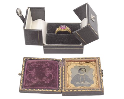Lot 155 - An Antique Etruscan style granulated gold three-stone pink sapphire and tourmaline set ring.