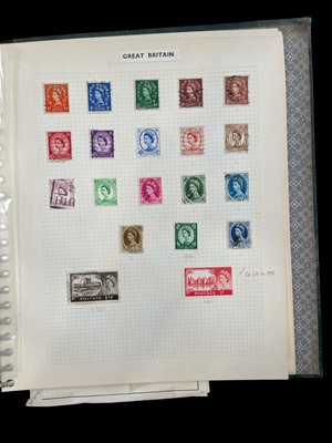 Lot 85 - An album of stamps organised into nations,...