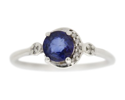 Lot 58 - A 9k white gold sapphire and diamond ring.