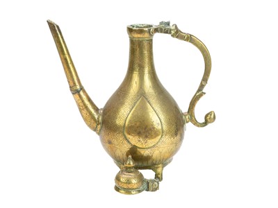 Lot 505 - A Mughal brass ewer and cover.
