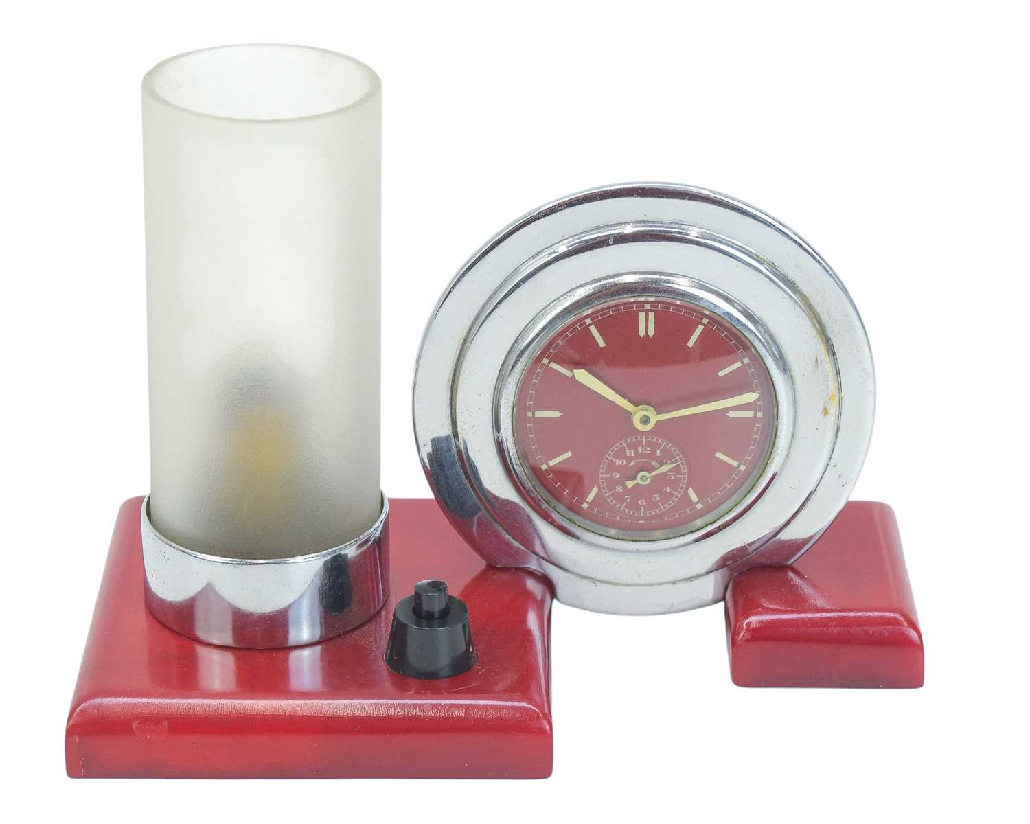 Lot 727 - An unusual Art Deco cherry amber, and chrome desk clock and lamp.