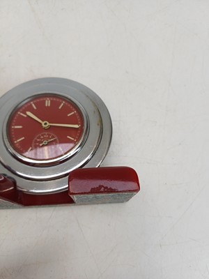 Lot 727 - An unusual Art Deco cherry amber, and chrome desk clock and lamp.