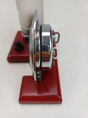 Lot 727 - An unusual Art Deco cherry amber, and chrome desk clock and lamp.