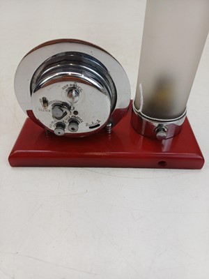 Lot 727 - An unusual Art Deco cherry amber, and chrome desk clock and lamp.