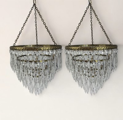 Lot 844 - A pair of four tier waterfall chandeliers.
