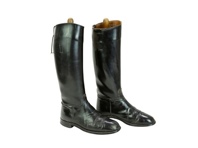 Lot 31 - A pair of black leather riding boots and trees.
