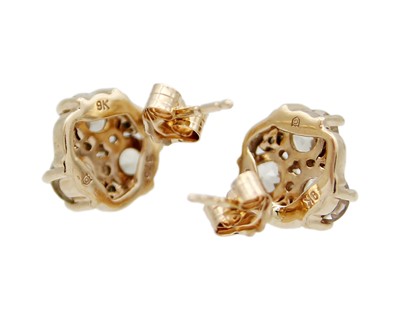Lot 29 - A pair of 9k gold, csarite (Turkish diaspore), and tsavorite garnet stud earrings.